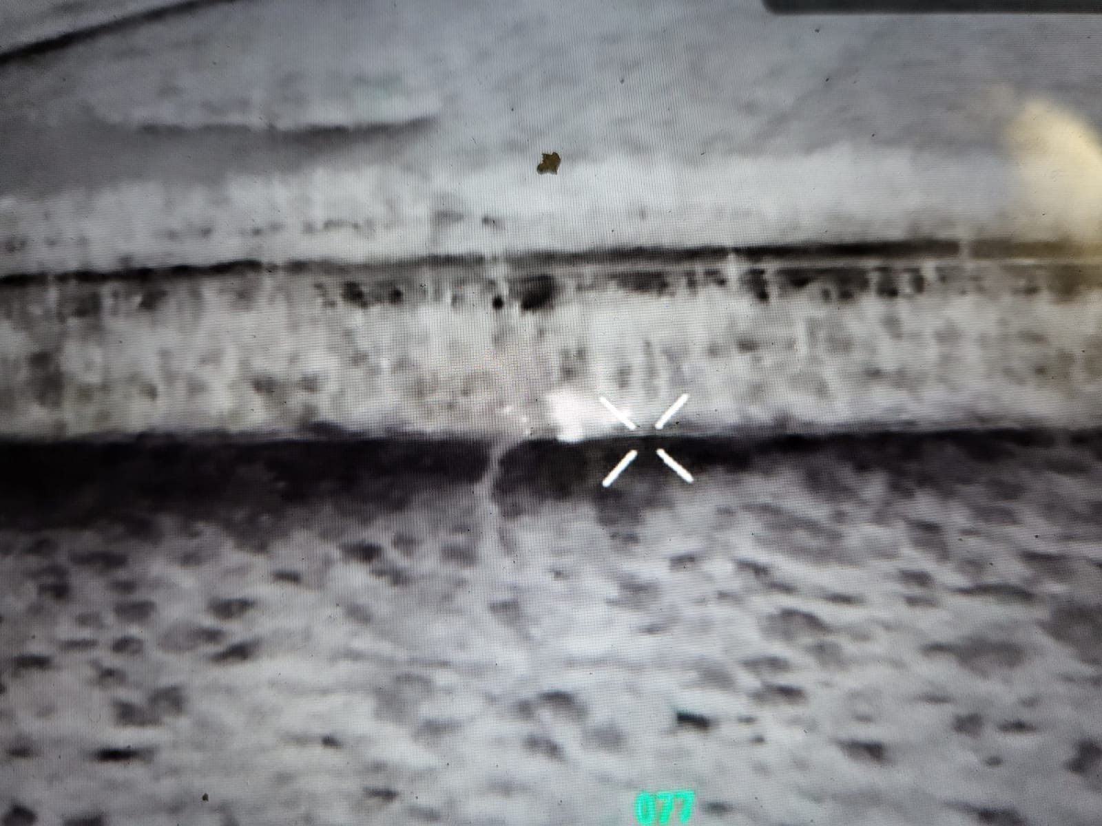 The drone’s camera captures enemy soldiers