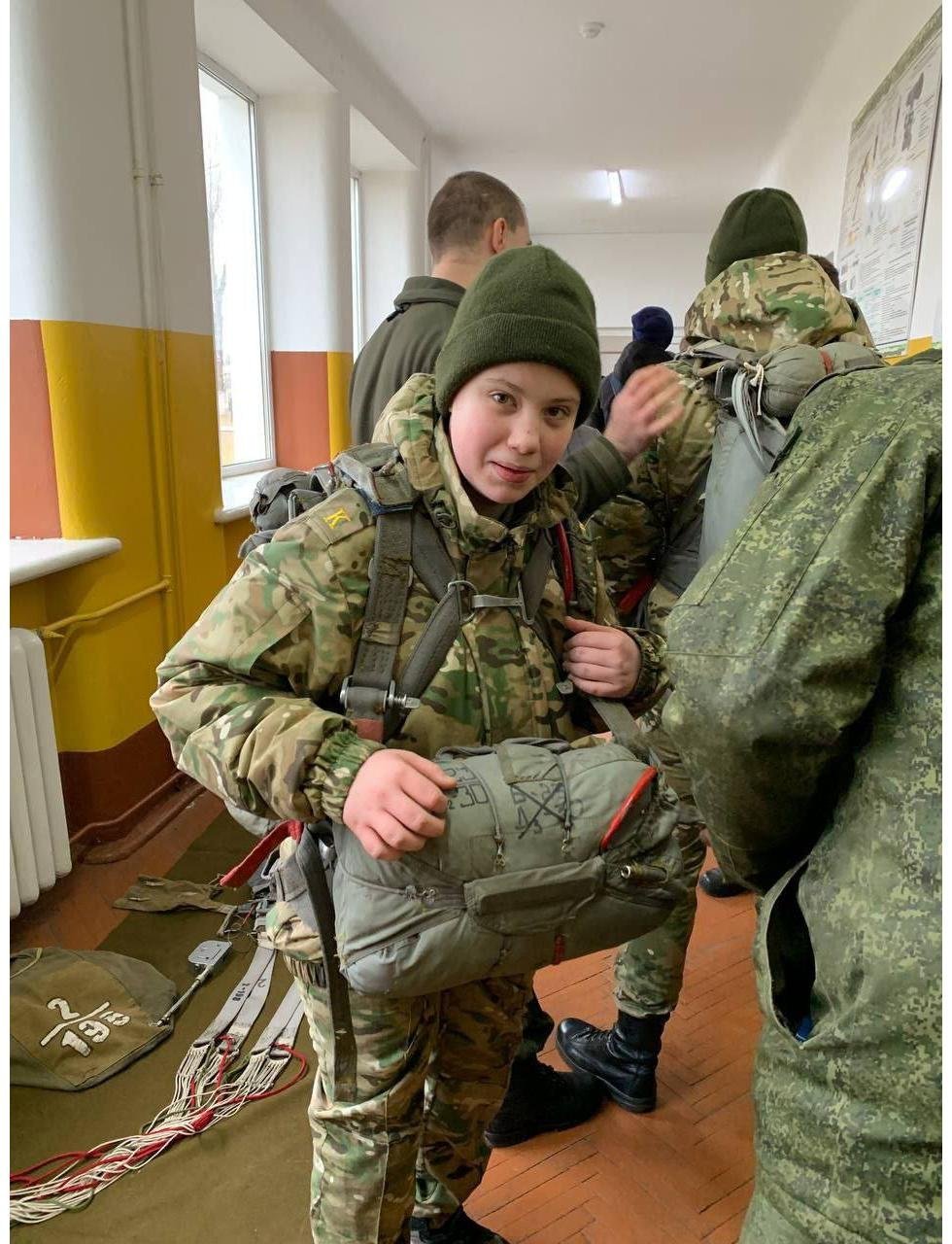 Children from the military-patriotic club "Krepost" train in paratrooper equipment
