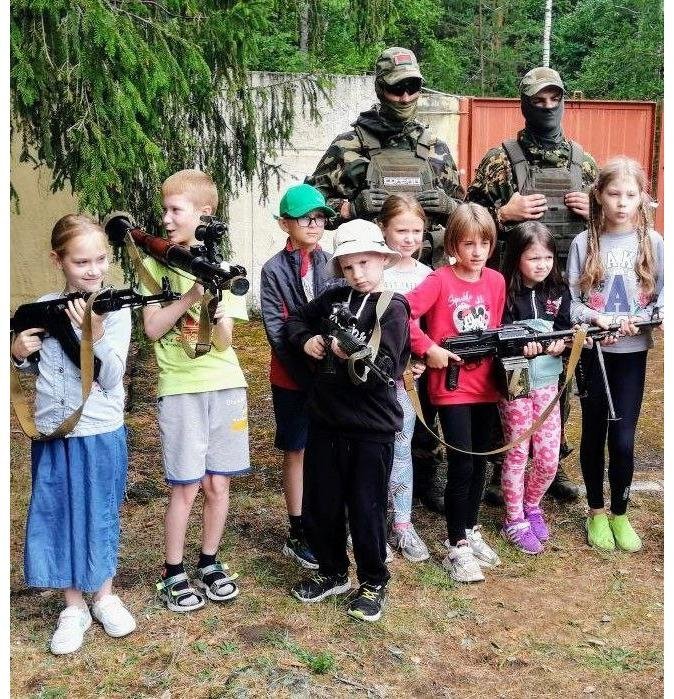 The 5th Brigade hides the faces of its soldiers. Instead, it flaunts the children's ones